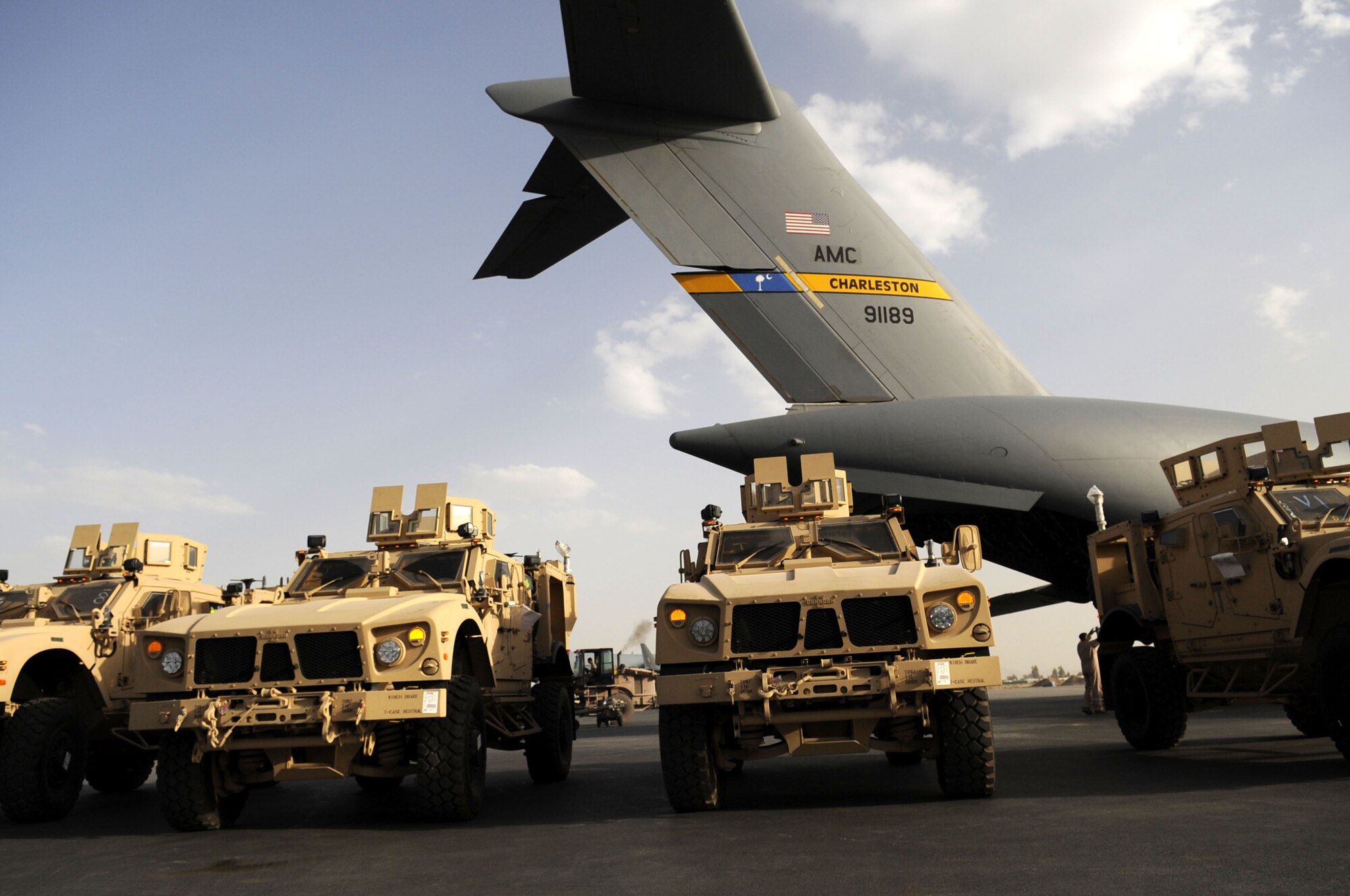 Mine Resistant Ambush Protected vehicles are just a few of the cargo items the 451st Expeditionary Logistics Readiness Squadron Aerial Port Flight downloads from aircraft everyday.  Typically, the porters move 446 tons of cargo daily. (U.S. Air Force photos by Senior Airman Nancy Hooks/Released)
