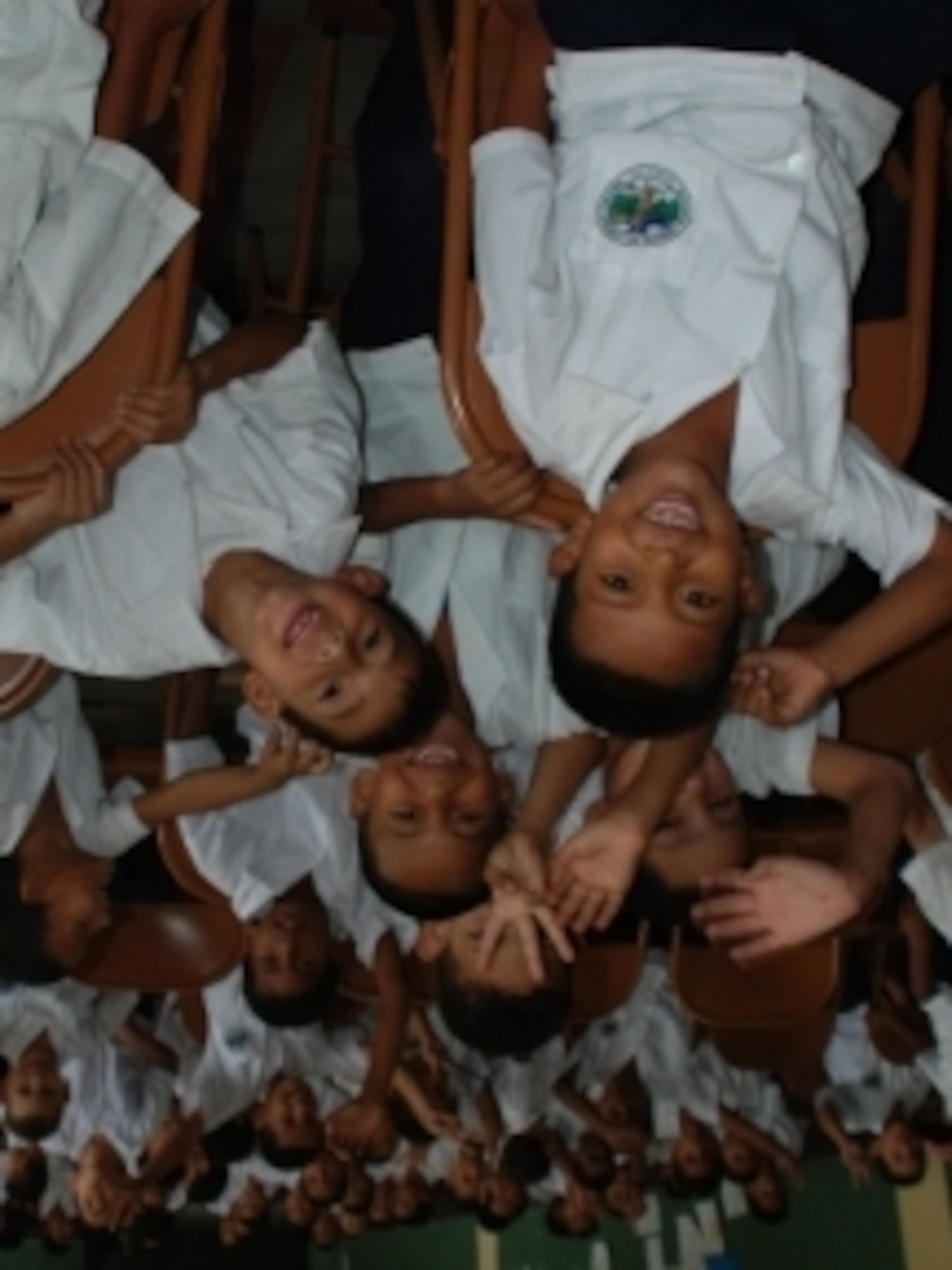 Students at Tegucigalpa's Lempira School are are all smiles during the closing ceremony of a Dental Readiness Training Exercise, in which many of the schoolchildren received free, high-quality dental care. Members of JTF-Bravo and U.S. Dental Command conducted the DENTRETE in Tegucigalpa, Honduras, April 19-29, treating 171 patients and performing 1,983 total procedures. (U.S. Air Force photo by 1st Lt. Jen Richard)
