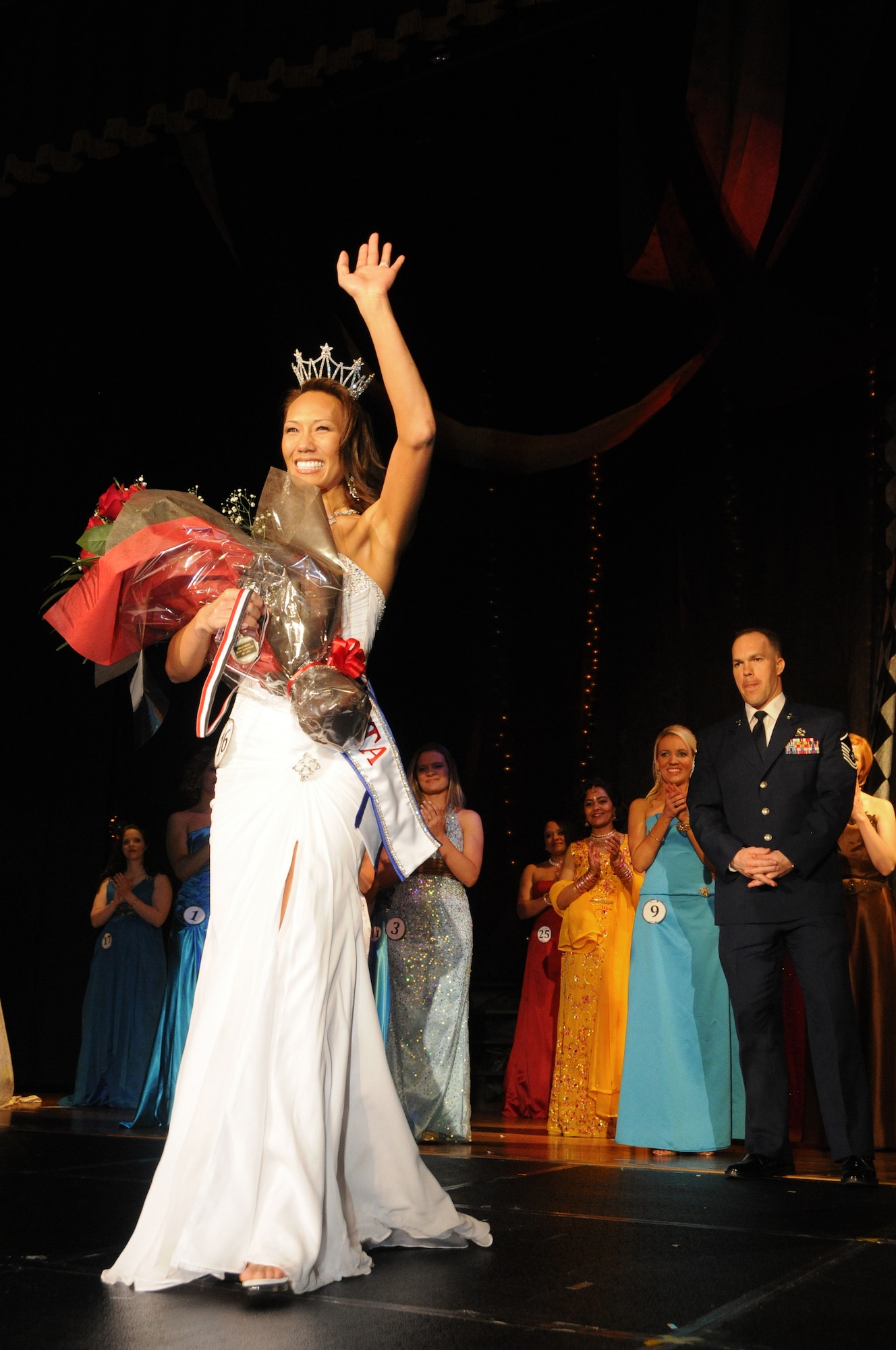 YOKOTA AIR BASE, Japan -- Forence Bigsby waves to the audience after being crowned Mrs. Yokota 2010. The Mrs. Yokota Organization is a non-profit organization created to provide scholarships to spouses of military members stationed at Yokota. (U.S. Air Force photo/Mark Allen)