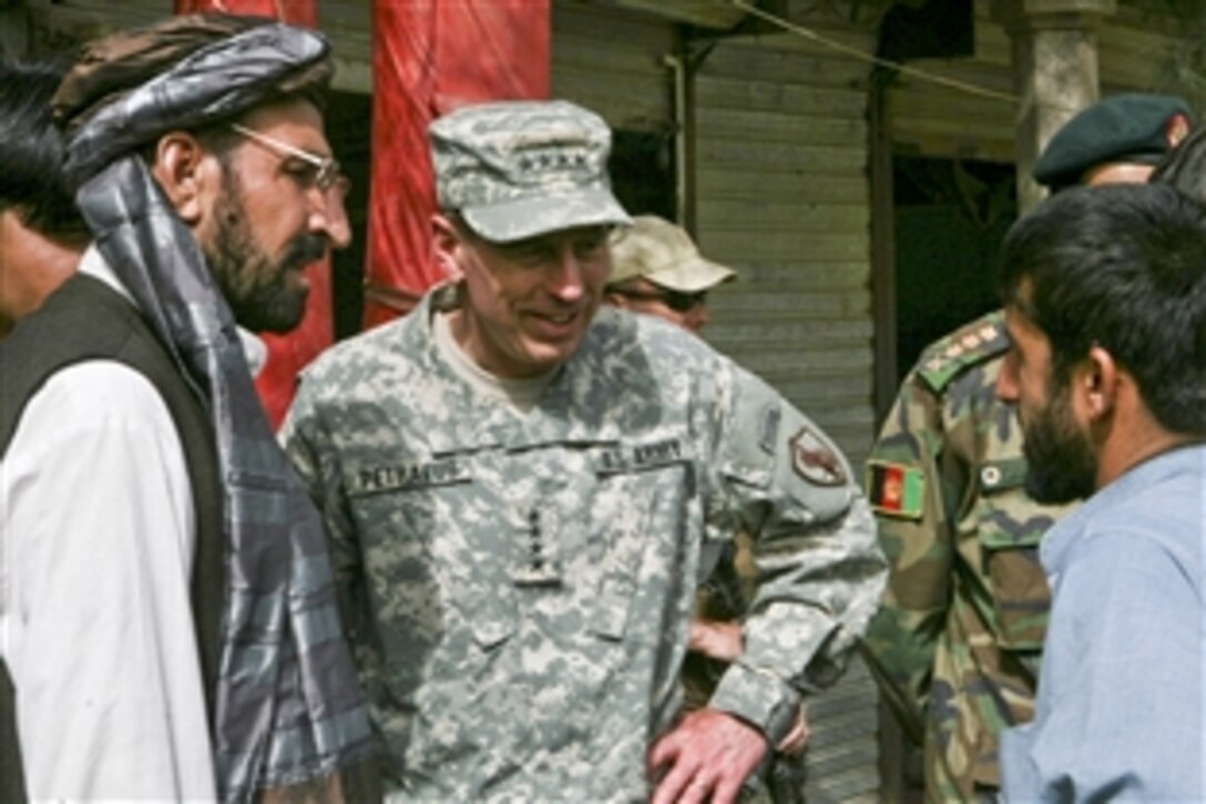 U.S. Army Gen. David Petraeus, commander of U.S. Central Command, speaks with local business owners while on patrol with Marines in Marja, Afghanistan, May 1, 2010. Petraeus met with several local leaders to hear their concerns about security and future plans. The Marines are assigned to the 1st Battalion, 6th Marine Regiment.