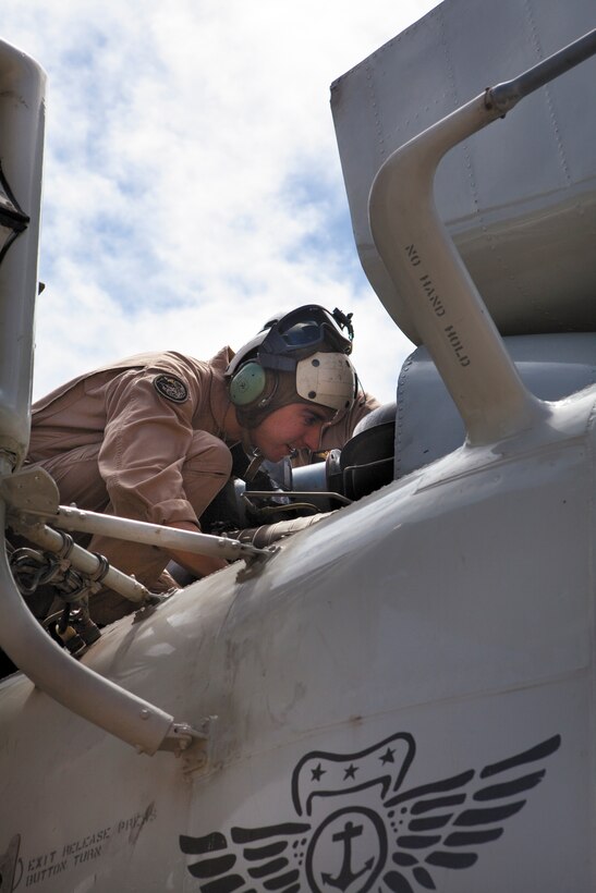 Capt. Lucas Frank, pilot training officer, Marine Heavy Helicopter Squadron 463, and a native of Philadelphia, Penn., performs a preflight inspection on a CH-53D Sea Stallion helicopter prior to departing on a training mission on Marine Corps Base Hawaii and Kalaupapa Airfield, Molokai, May 5. Pilots and crewmen with the squadron practiced section confined area landings (CALs) and field carrier landings (FCLPs) to earn qualifications and prepare for the upcoming Rim of the Pacific Exercise beginning in June.