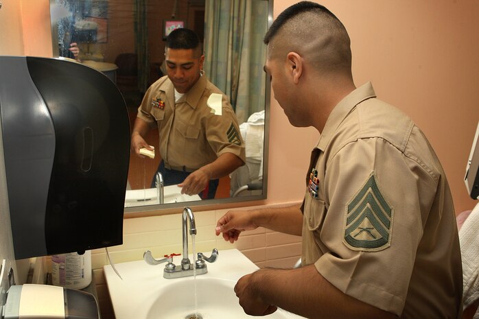 U. S. Marine Corps Reserve Staff Sgt. Gonzalo Cano, a Food Service Specialist with 3rd Battalion, 24th Marines out of St. Louis Mo., helps the Veterans Affairs Boston Health Care System, West Roxbury Campus flush the contaminated water out of all of the sinks after 3 days of non-use due to a major water main break in Boston, Mass., on May 4, 2010. Cano, a 27 year old Chicago native, was one of several Marines volunteering at the local Veterans Affairs Medical Centers in support of Marine Week Boston. Marine Week Boston provides an opportunity to increas public awareness of the Marine Corps' value to our nation's defense and to preserve and mature the Corps' relationship with the American people.