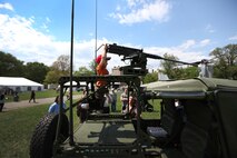 Jack Guy, a 2-year-old Boston native trades in his super soaker for a .50 caliber heavy machine gun at Boston Common May 4, 2010. Numerous vehicle and weapon displays were available for the Boston public as part of Marine Week May 3-9. The week's events are an opportunity to share the Corps' culture, history and tradition with Bostonians and for them to learn about the Corps' value to the nation.