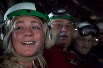 Laura O'Neil, a Boston native and member on the board of trustees for the USS Constitution museum gets a glimpse of the city from inside a MV-22 Osprey May 4, 2010. The Osprey is part of the aviation displays available during Marine Week May 3-9.
