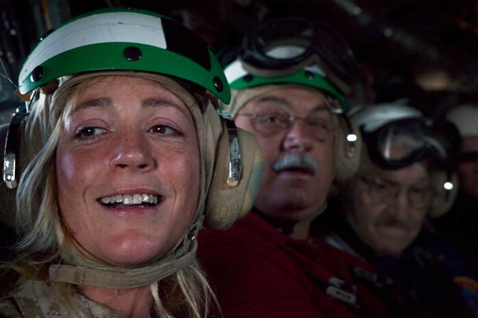 Laura O'Neil, a Boston native and member on the board of trustees for the USS Constitution museum gets a glimpse of the city from inside a MV-22 Osprey May 4, 2010. The Osprey is part of the aviation displays available during Marine Week May 3-9.