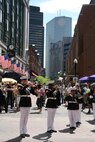 Albany Marine Band performs ''God Bless America,'' in downtown Boston, Mass., in a crowd of surrounding Bostonians, May 4, 2010, for Marine Week Boston.  Albany Marine Band performed several songs to include, ''Stars and Stripes, Marines' Hymn, What a Wonderful World and Semper Fi.'' The band's performance played a key role in Marine Week Boston to share the Corps' traditions, history and culture with Bostonians and help them learn about the Corps' value to the nation.