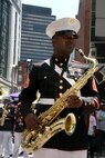 Staff Sgt. Jordan Dixon, a saxophone player for Albany Marine Band and native of Baton Rouge, La., takes a breath after playing a solo, ''What a Wonderful World,'' during a series of songs played in downtown Boston, Mass., in a crowd of surrounding Bostonians, May 4, 2010, for Marine Week Boston. The performance included songs such as, ''Stars and Stripes, Marines' Hymn and Semper Fi.'' The band's performance played a key role in Marine Week Boston to share the Corps' traditions, history and culture with Bostonians and help them learn about the Corps' value to the nation.