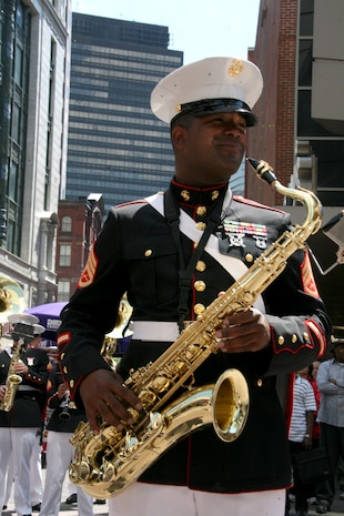 Staff Sgt. Jordan Dixon, a saxophone player for Albany Marine Band and native of Baton Rouge, La., takes a breath after playing a solo, ''What a Wonderful World,'' during a series of songs played in downtown Boston, Mass., in a crowd of surrounding Bostonians, May 4, 2010, for Marine Week Boston. The performance included songs such as, ''Stars and Stripes, Marines' Hymn and Semper Fi.'' The band's performance played a key role in Marine Week Boston to share the Corps' traditions, history and culture with Bostonians and help them learn about the Corps' value to the nation.