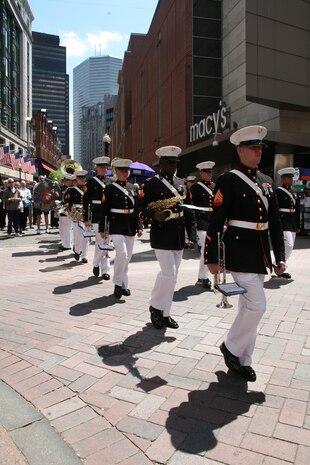 Albany Marine Band marches to Boston Common after a series of songs performed at Faneuil Hall Marketplace, and streets of downtown Boston, May 4, 2010. The band played several songs to include, ''Stars and Stripes, Marines' Hymn, What a Wonderful World, Georgia, God Bless America and Semper Fi.'' The band's performance played a key role in Marine Week Boston to share the Corps' traditions, history and culture with Bostonians and help them learn about the Corps' value to the nation.