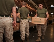 A jar of chili escaped from the conveyor belt as Marines with Company L, 3rd Battalion, 24th Marine Regiment, and Mobilization Command, Marine Forces Reserve, provide volunteer service by sorting a packaging sealed foods at the Great Boston Food Bank May 4, 2010. The Marines are volunteering in support of Marine Week Boston, where they'll provide service to community groups, host physical fitness challenges and sports clinics in city parks and showcase state-of-the-art Marine vehicles, aircraft and equipment.