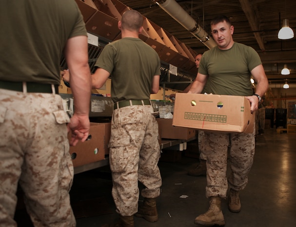 A jar of chili escaped from the conveyor belt as Marines with Company L, 3rd Battalion, 24th Marine Regiment, and Mobilization Command, Marine Forces Reserve, provide volunteer service by sorting a packaging sealed foods at the Great Boston Food Bank May 4, 2010. The Marines are volunteering in support of Marine Week Boston, where they'll provide service to community groups, host physical fitness challenges and sports clinics in city parks and showcase state-of-the-art Marine vehicles, aircraft and equipment.