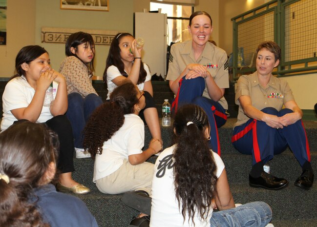 Sergeant Tiffany Benson, a disbursing clerk with Marine Forces Reserve, participates in a leadership exercise with members of the Boys and Girls Club, May 4, 2010. Four female Marines from various units throughout the Marine Corps volunteered to share their personal stories of endurance and success with the young girls in support of Marine Week Boston, May 3-9.