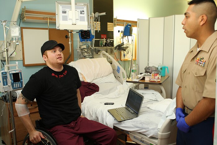 U. S. Marine Corps Reserve Staff Sgt. Gonzalo Cano, a Food Service Specialist with 3rd Battalion, 24th Marines out of St. Louis Mo., visits Lance Cpl. James Crosby at the Veterans Affairs Boston Health Care System, West Roxbury Campus in support of Marine Week Boston on May 4, 2010. Crosby, a Winthrop, Mass., native, suffered a spinal cord injury due to rocket fire in Al Asad, Iraq in support of Operation Iraqi Freedom, March 2004.