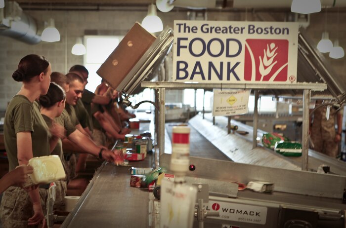 Marines with Company L, 3rd Battalion, 24th Marine Regiment, and Mobilization Command, Marine Forces Reserve, provide volunteer service by sorting a packaging sealed foods at the Great Boston Food Bank May 4, 2010. The Marines are volunteering in support of Marine Week Boston, where they'll provide service to community groups, host physical fitness challenges and sports clinics in city parks and showcase state-of-the-art Marine vehicles, aircraft and equipment.