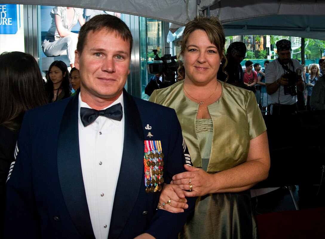 Chief Master Sgt. Antonio Travis and his wife, Andrea, walk the red carpet during the 2010 TIME 100 gala event May, 4, 2010, at the Lincoln Center in New York City. Chief Travis was named one of the 100 most influential people in the world by the editors of TIME magazine for his efforts following the Haiti earthquake. Chief Travis is the chief enlisted manager of the Air Force Special Operations Training Center at Hurlburt Field, Fla. (U.S. Air Force photo/Staff Sgt. Bennie J. Davis III)