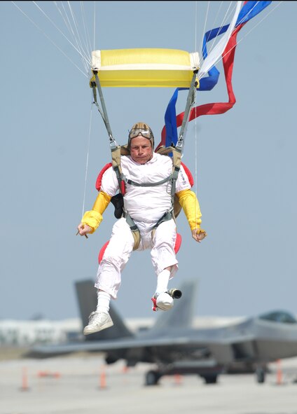 A skydiver floats to the flightline during the opening ceremonies at the March Field AirFest, March Air Reserve Base, Calif., May 2, 2010. The AirFest is a bi-annual, two-day event featuring military and civilian aerial performances and static displays of modern and historic aircraft. (U.S. Air Force photo by Senior Airman Sean Adams/released)