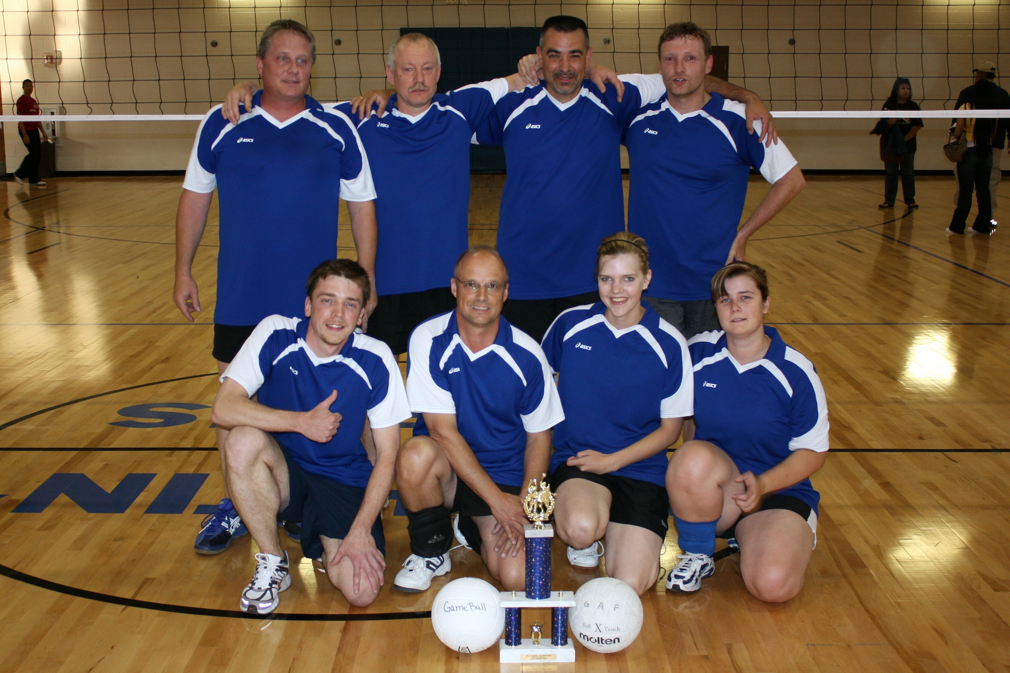 HOLLOMAN AIR FORCE BASE, N.M. -- The winners from the 2010 Volleyball Season Championship, the German Air Force Flying Training Center team, pauses for a group photo with their winning trophy April 30, 2010. The GAF FTC team won the championship game against the 49th Force Support Squadron team A in two sets, 25-15 and 25-20. (Courtesy photo / Released)