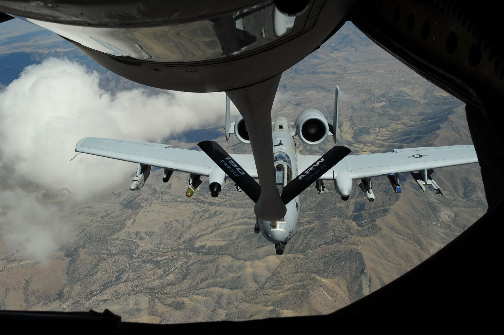 A KC-135 Stratotanker from the Kansas Air National Guard's 117th Air Refueling Squadron, based out of Forbes Field, Kan., refuels an A-10C Thunderbolt II April 27, 2010, from the 355th Fighter Wing at Davis-Monthan Air Force Base, Ariz.  The tanker crew supported refueling missions throughout the week so students enrolled in the A-10C Pilot Initial Qualification Course could accomplish their first air-to-air refueling. (U.S. Air Force photo/Airman Jerilyn Quintanilla)