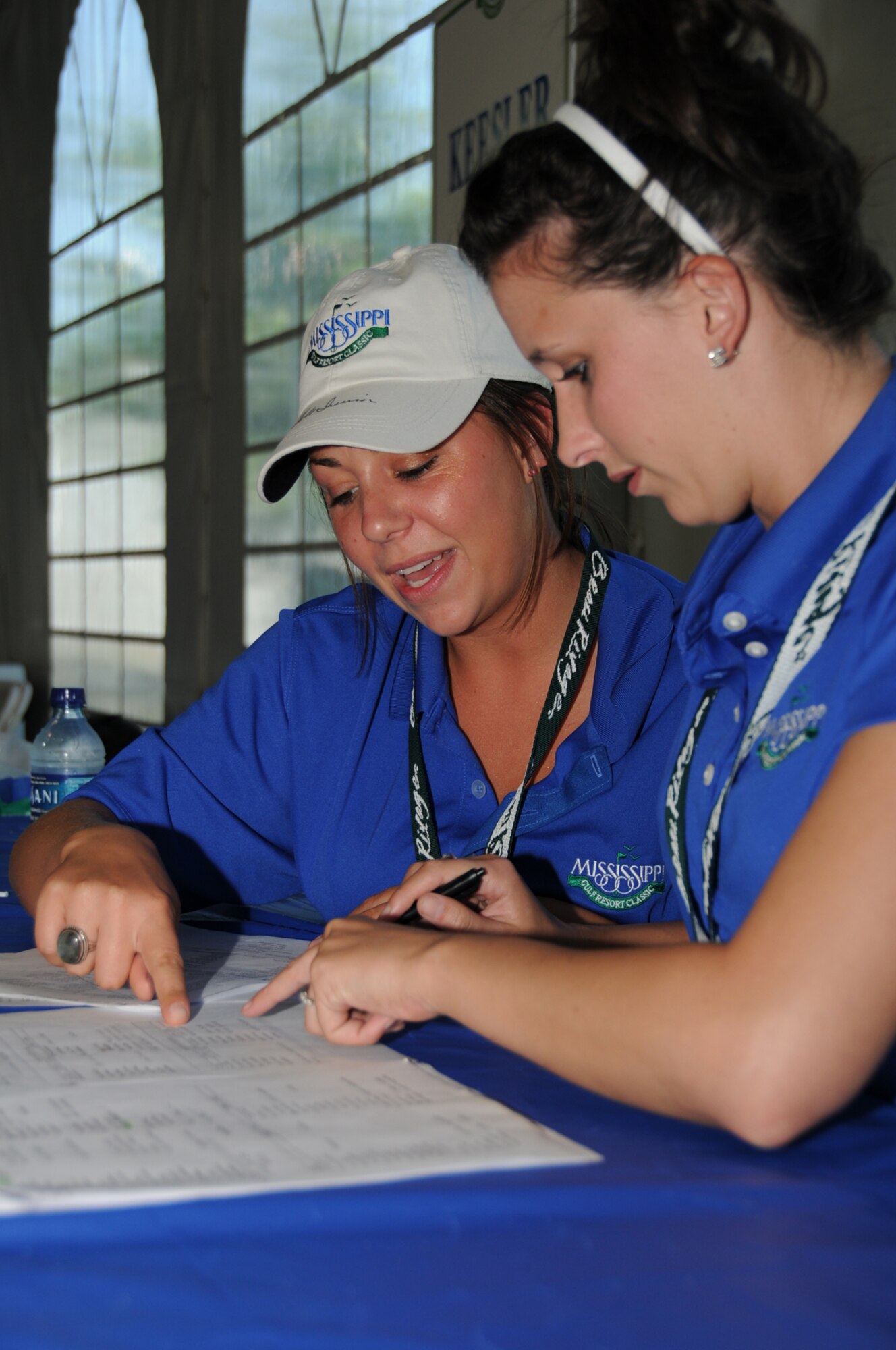 Lisa Spitler, 81st Medical Support Squadron, and Katie Stanek, 81st Logistics Readiness Squadron, are among the 250 Keesler volunteers at the Mississippi Gulf Resort Classic, April 28 through Sunday.  (U.S. Air Force photo by Kemberly Groue)
