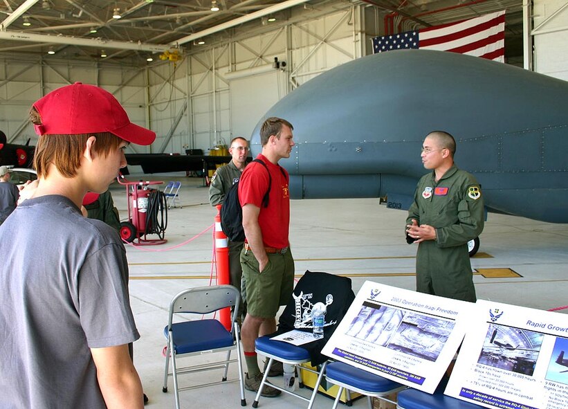 Senior Airman Bobby Birch, 12th Reconnaissance Squadron, answers questions from Boy Scouts about the RQ-4 “Global Hawk,” May 1 at the flight line. The Boy Scouts came to Beale May 1-2 for the 2010 Boy Scouts of America Expo. (U.S. Air Force photo by Capt. Natasha Waggoner)