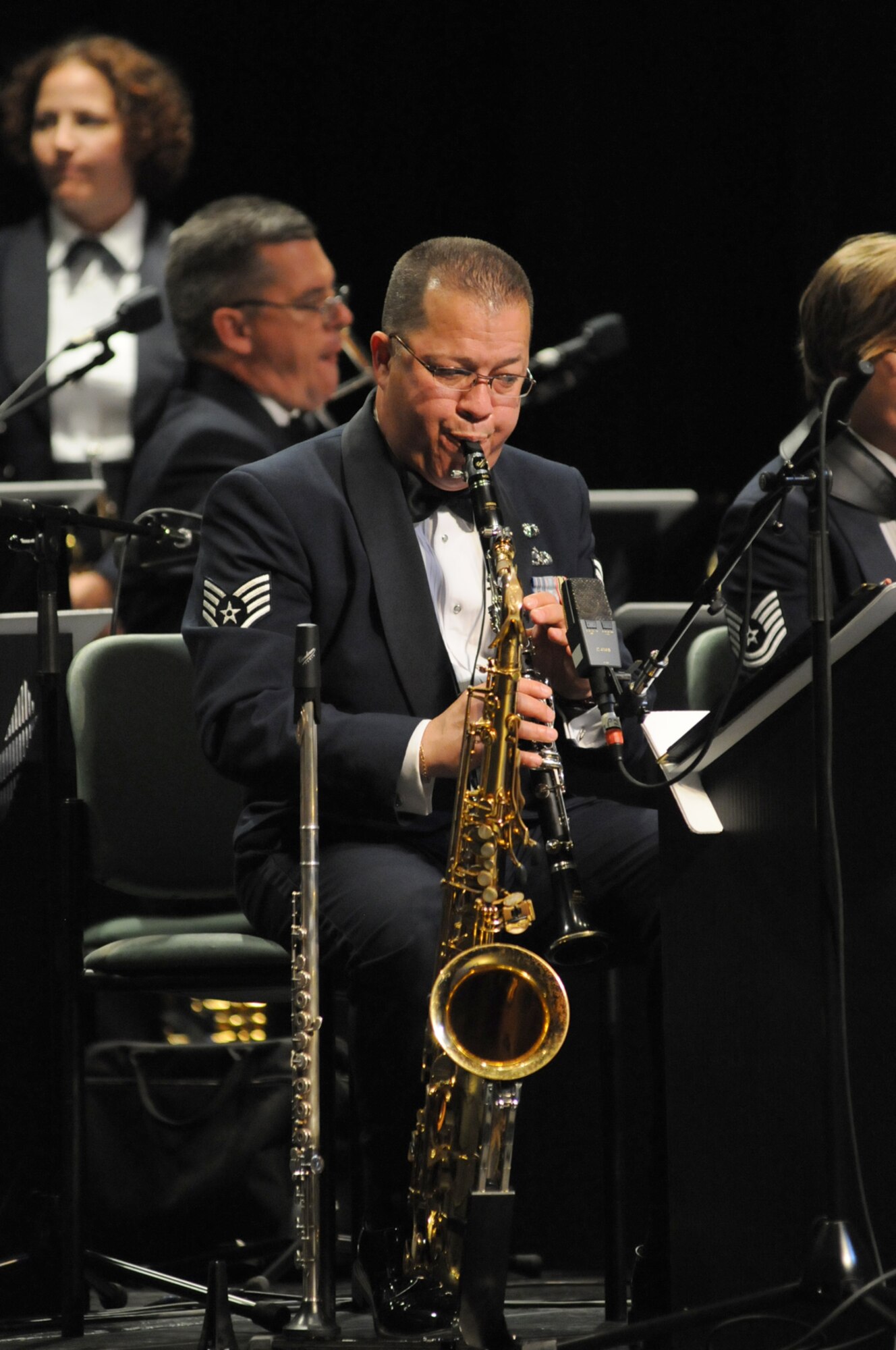 Staff Sgt. Marco Munoz belts out a melody on the clarinet, one of several instruments he plays with Full Spectrum.  (U.S. Air Force photo by Kemberly Groue)