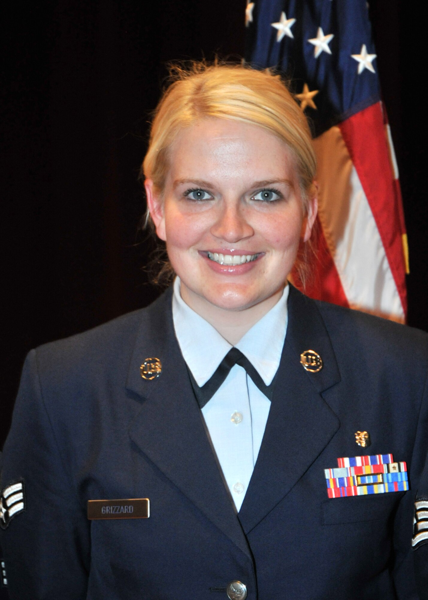 Mississippi Gulf Coast Community College Sal D’Aquilla Award provides $100 scholarships towards textbooks and supplies to Senior Airman Casey Grizzard, 81st Medical Operations Squadron.  (U.S. Air Force photo by Adam Bond)
