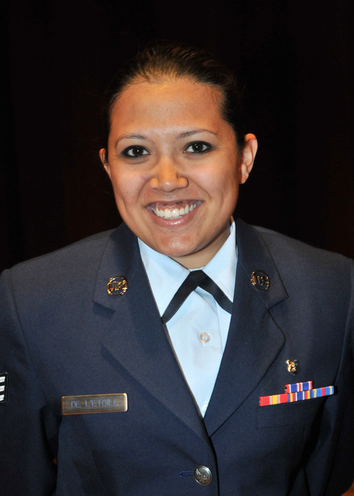 The Chiefs’ Group Scholarship for $200 presented to Senior Airman Sheila De’Letoile, 81st AMDS, is for a student pursuing a first CCAF degree to help with the purchase of books.  (U.S. Air Force photo by Adam Bond)

