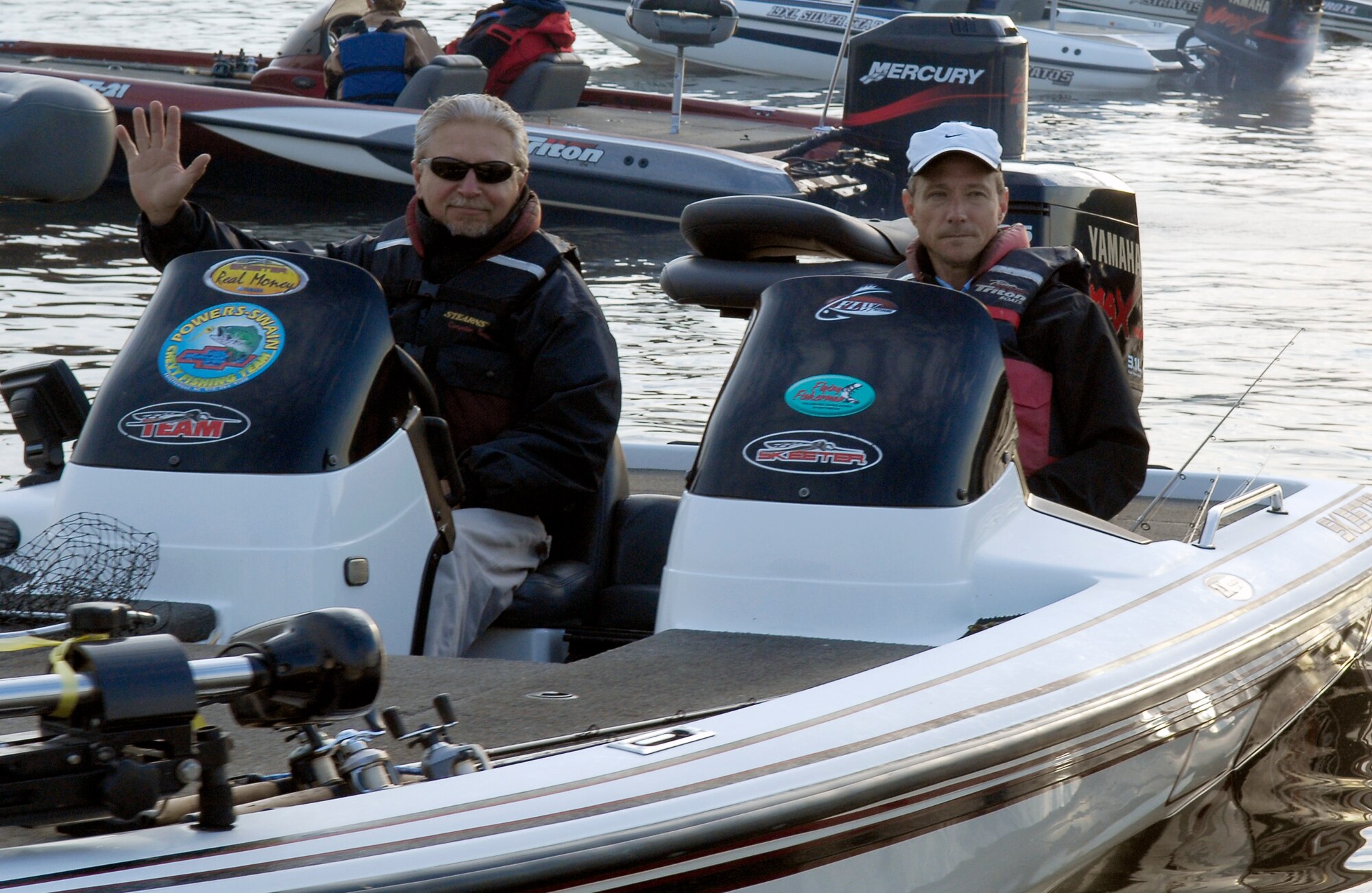 Col. Charles Dunn (right), 43rd Mission Support Group Commander, and his boater, Richard Szczerbala wait on their boat for the signal to begin locating a fishing spot on Jordan Lake in Raleigh N.C. during the fifth annual Warriors on the Water fishing tournament April 23. Colonel Dunn was one of more than 25 Pope Airmen who were selected to participate in this year’s tournament. Colonel Dunn and Mr. Szczerbala took 9th place in the tournament with a total weight of 13 pounds, 15 ounces of fish.  (U.S. Air Force photo/Senior Airman Kris Levasseur)
