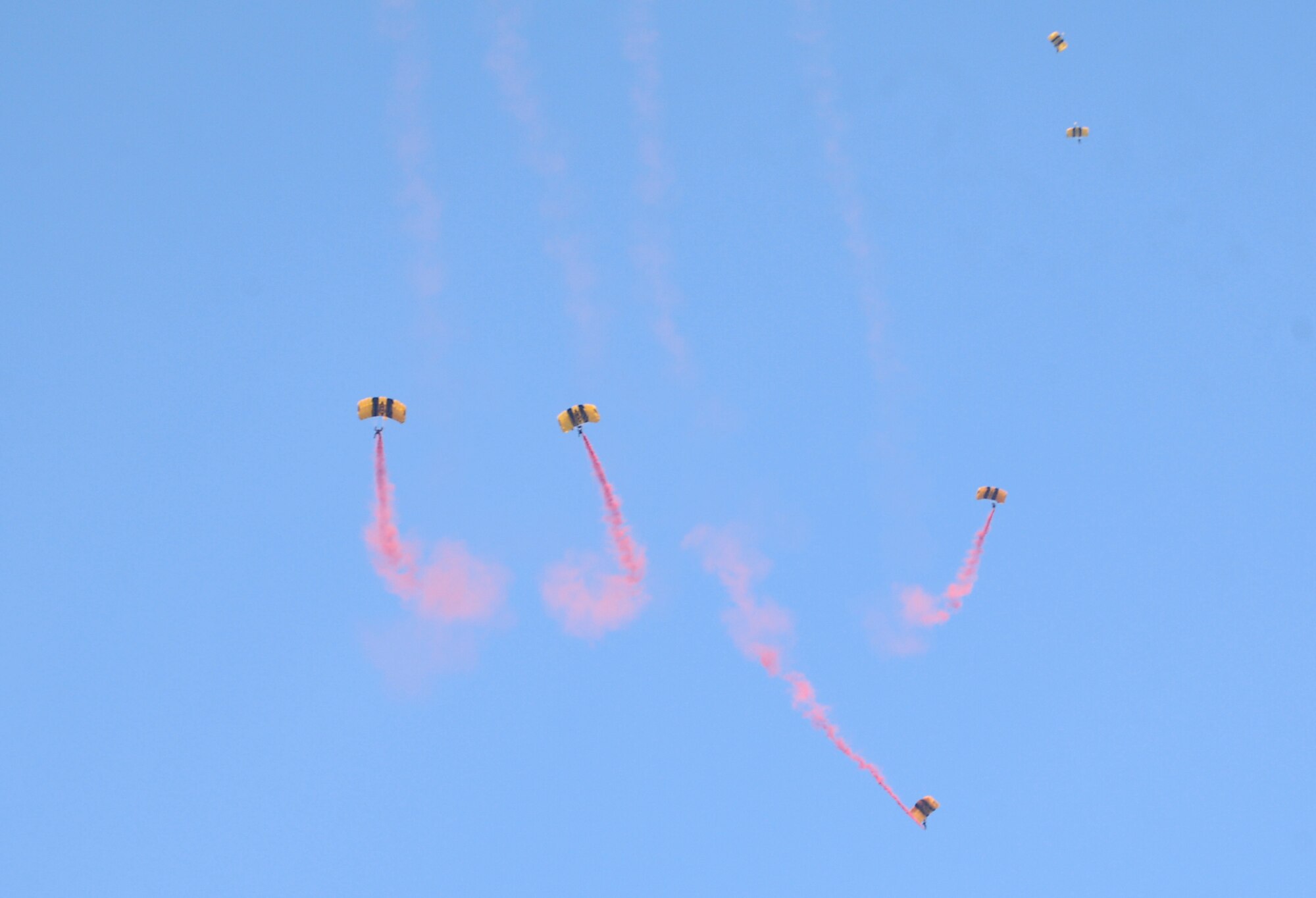 The Golden Knights, an Army aerial demonstration team, descend on the New Hope Outlook boat ramp on Jordan Lake in Raleigh N.C. during the opening ceremony of the fifth annual Warriors on the Water fishing tournament. Warriors on the Water is a fast-growing tradition among service members where Airmen, Soldiers, Marines and Sailors are given food, supplies and a seat on a boat with an experienced fisherman all at no cost to the service member. (U.S. Air Force photo/Senior Airman Kris Levasseur)