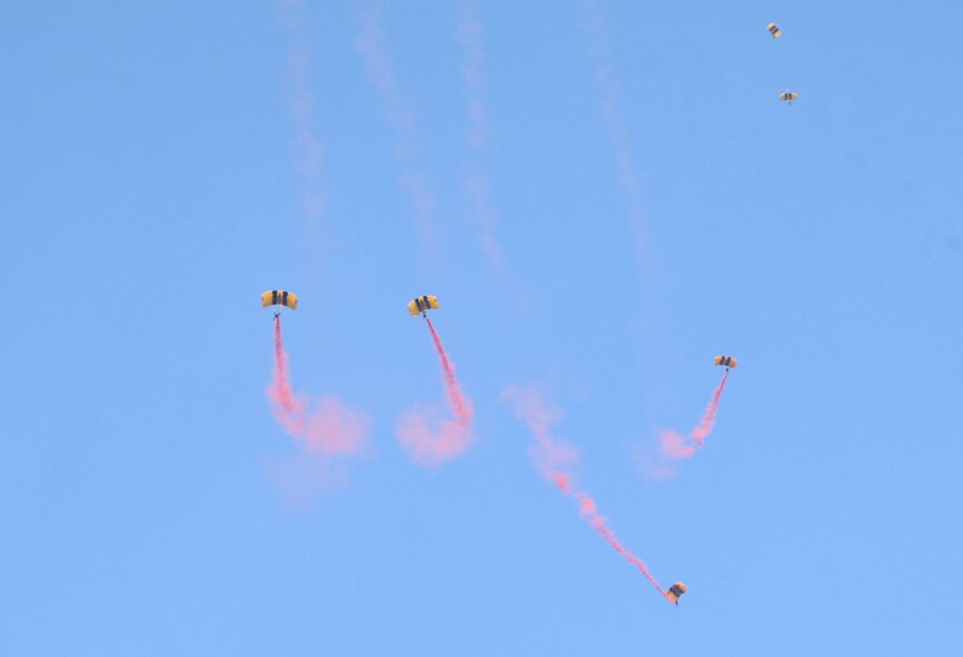 The Golden Knights, an Army aerial demonstration team, descend on the New Hope Outlook boat ramp on Jordan Lake in Raleigh N.C. during the opening ceremony of the fifth annual Warriors on the Water fishing tournament. Warriors on the Water is a fast-growing tradition among service members where Airmen, Soldiers, Marines and Sailors are given food, supplies and a seat on a boat with an experienced fisherman all at no cost to the service member. (U.S. Air Force photo/Senior Airman Kris Levasseur)