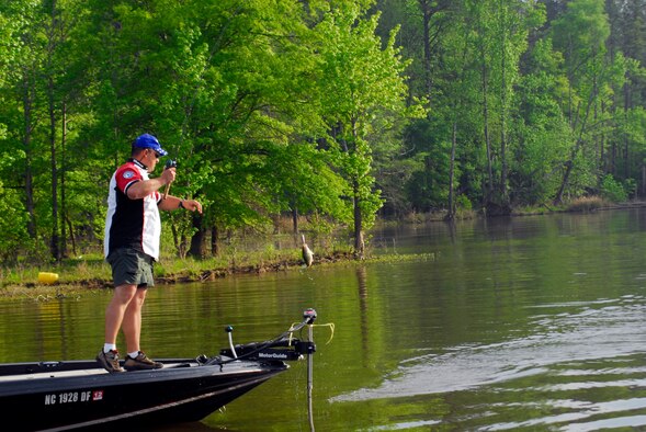 A fisherman pulls in his first catch of the day on Jordan Lake in Raleigh N.C. during the fifth annual Warriors on the Water fishing tournament April 23. The tournament’s more than 300 participants caught more than 200 fish weighing approximately 690 pounds. (U.S. Air Force photo/Senior Airman Quentin Irvin)