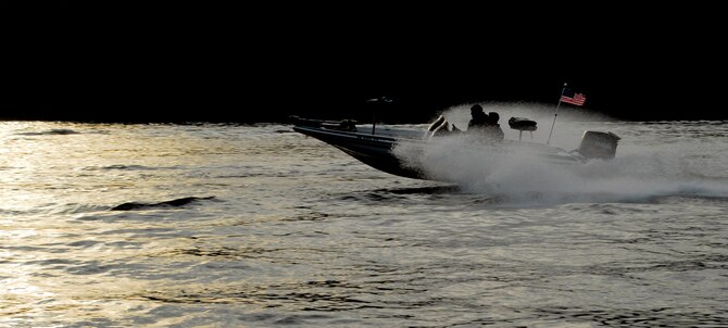 One of the first boats participating in the fifth annual Warriors on the Water fishing tournament takes off at full speed to find a fishing spot on Jordan Lake in Raleigh N.C. April 23. This year’s tournament drew more than 150 Airmen, Soldiers, Marines and Sailors from military installations across the country. (U.S. Air Force photo/Senior Airman Quentin Irvin)