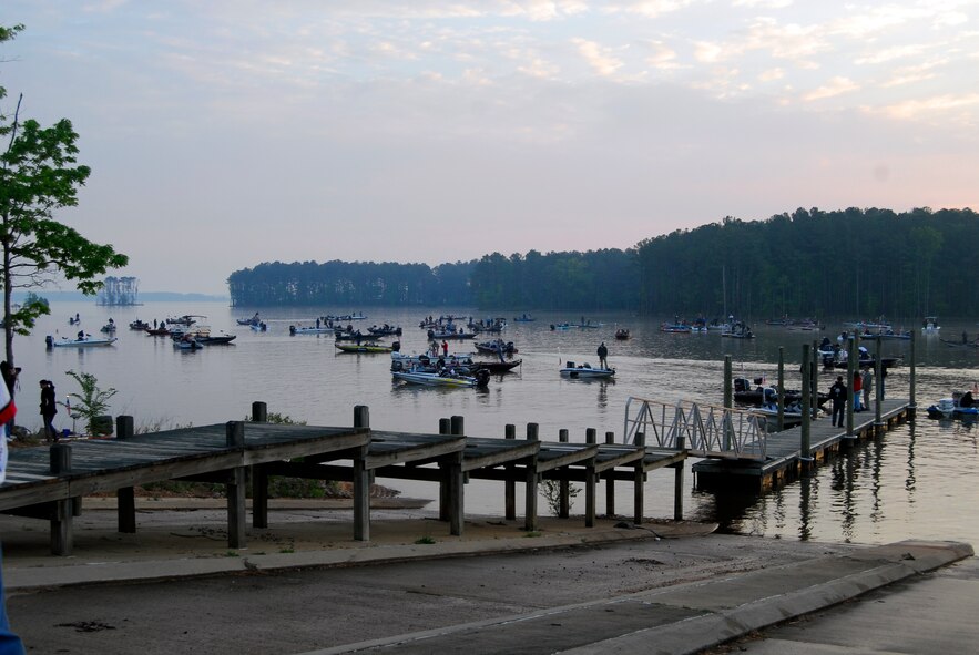 Hundreds of boats gather near the New Hope Outlook boat ramp on Jordan Lake in Raleigh N.C. to view an Army aerial demonstration by the Golden Knights during the opening ceremony of the fifth annual Warriors on the Water fishing tournament. Warriors on the Water is a fast-growing tradition among service members where Airmen, Soldiers, Marines and Sailors are given food, supplies and a seat on a boat with an experienced fisherman all at no cost to the service member. (U.S. Air Force photo/Senior Airman Quentin Irvin) 