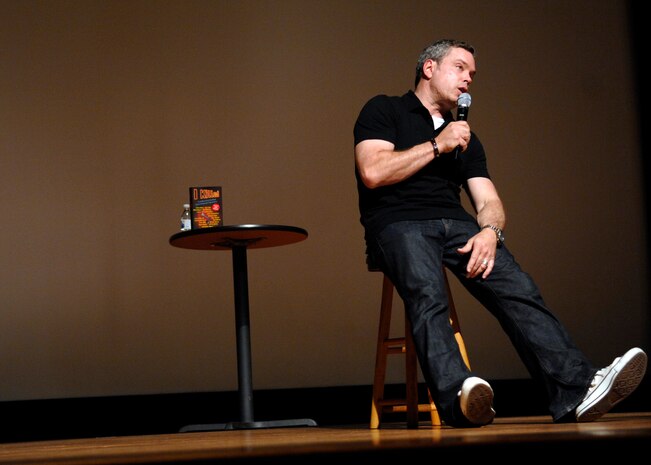 Comedian Bernie McGrenahan talks about his experiences with drunk driving and the negative affects they had on his life April 30, 2010, on Joint Base Charleston, S.C. Bernie McGrenahan visited JB CHS after first appearing at the base theater in 2008 to speak to Airmen about making good decisions and what some of the outcomes can be. Bernie's comedy routine made the audience laugh while providing a positive message on topics such as sexual assault, irresponsible drinking and drug abuse. (U.S. Air Force photo/Senior Airman Timothy Taylor)