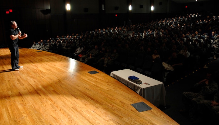 Comedian Bernie McGrenahan performs his stand-up routine for Airmen April 30, 2010, on Joint Base Charleston, S.C. Bernie McGrenahan visited JB CHS after first appearing at the base theater in 2008 to speak to Airmen about making good decisions and what some of the outcomes can be. Bernie's comedy routine made the audience laugh while providing a positive message on topics such as sexual assault, irresponsible drinking and drug abuse.(U.S. Air Force photo/Senior Airman Timothy Taylor)