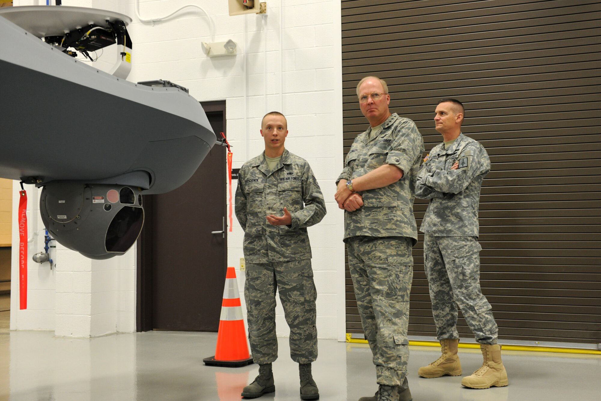 National Guard Bureau Chief, US Air Force General Craig R. McKinley and The Adjutant General of New York, US Army Brig. Gen. Patrick Murphy receive a rundown of the capabilities of the MQ-9 Reaper, Remotely Piloted Aircraft from US Air Force Tech. Sgt. Eric W. Schenck at Hancock Field in Syracuse, NY on 5 May 2010. McKinley and Murphy were getting a tour of the school house responsible for all MQ-9 Reaper Remotely Piloted Aircraft maintenance training for the US Air Force. (US Air Force photo by Tech. Sgt. Jeremy M. Call/Released)