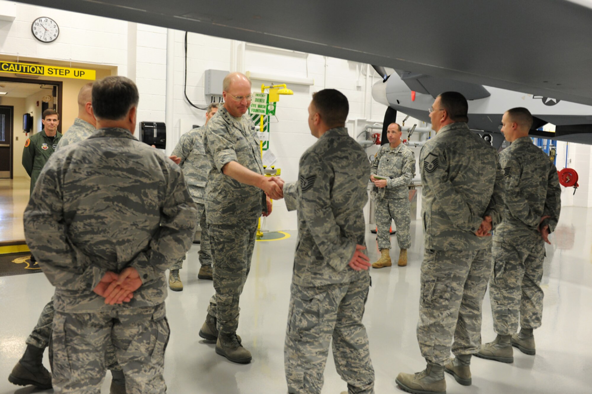 National Guard Bureau Chief, US Air Force General Craig R. McKinley meets with instructors at the Field Training Detachment at Hancock Field in Syracuse, NY on 5 May 2010.  McKinley was getting a tour of the school house responsible for all MQ-9 Reaper Remotely Piloted Aircraft maintenance training for the US Air Force. (US Air Force photo by Tech. Sgt. Jeremy M. Call/Released)