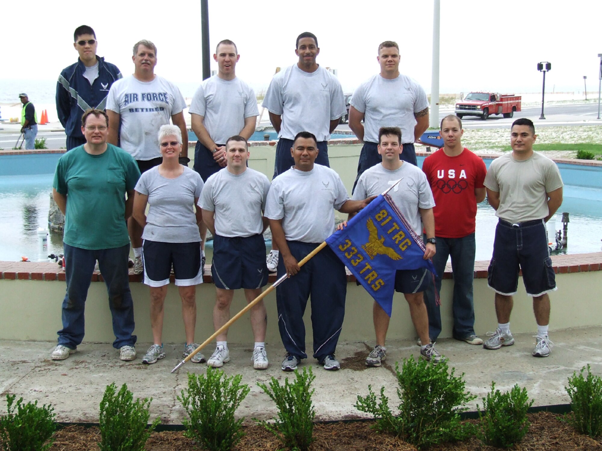 A dozen student and staff volunteers from the 333rd Training Squadron landscaped the area around the refurbished fountain on Highway 90 near White Avenue April 30. (Courtesy photo)