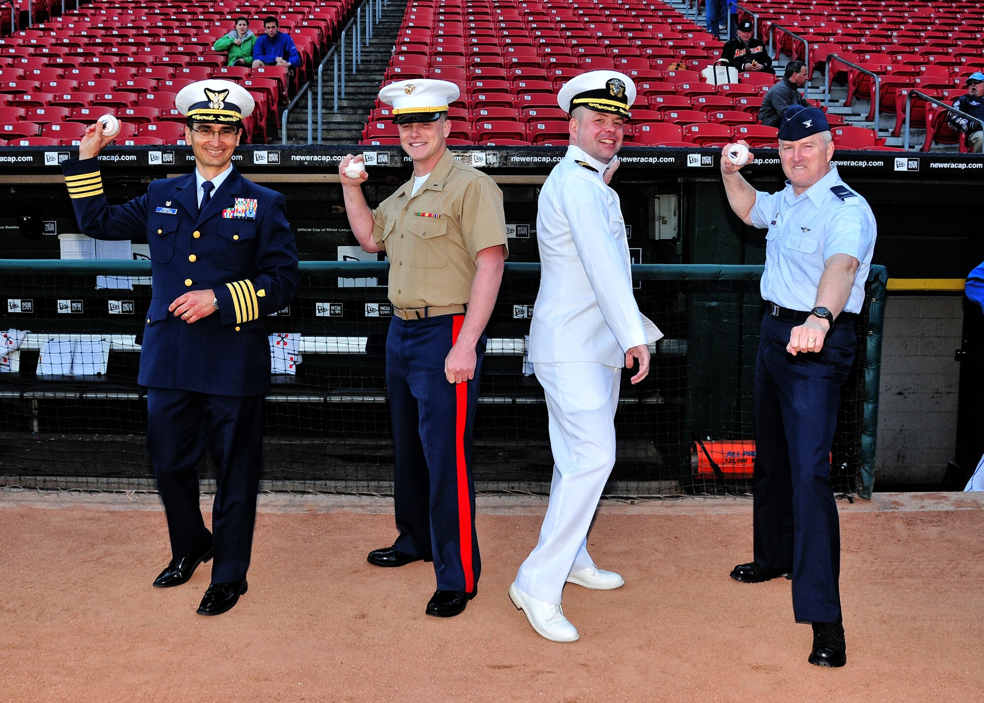 As part of Military appreciation night Officers of the Coast Guard, Marines, Navy and Air Force warm up their arms in preparation of throwing the first pitches during the pregame events at Coca-Cola Stadium, May 4, 2010, Buffalo NY.  This was just one of many events held during Armed Forces Week. (U.S. Air Force photo by Staff Sgt. Joseph McKee)