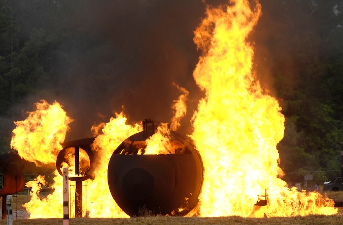 A mock C-17 is set ablaze during a Major Accident Response Exercise on Joint Base Charleston, S.C., May 4, 2010. The annual exercise was part of a simulation which included a plane crash. The exercise is used to help test and train the supporting agencies who would respond in case of an emergency. (U.S. Air Force Photo/Airman 1st Class Lauren Main)