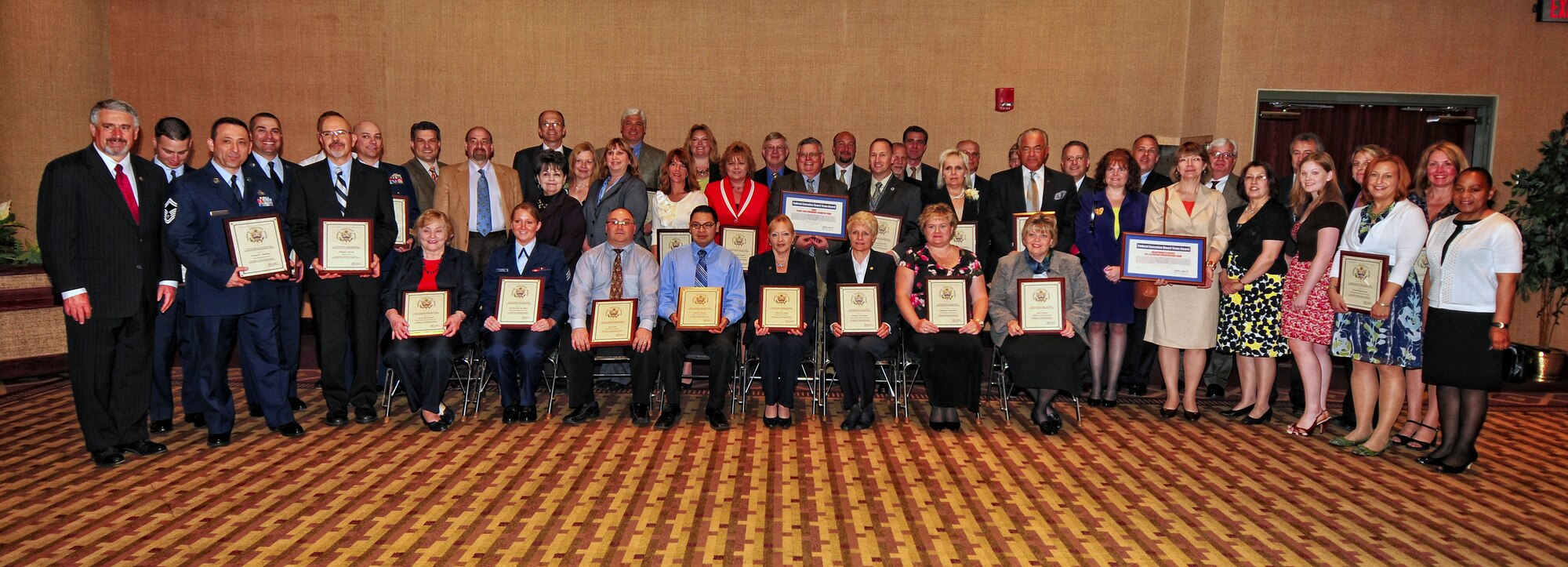 The Buffalo Federal Executive Board Excellence in Government award recipients show their awards after the luncheon in their honor, May 4, 2010, Buffalo NY. The award luncheon celebrating excellence in public service was held in the Buffalo convention center. (U.S. Air Force photo by Staff Sgt. Joseph McKee)