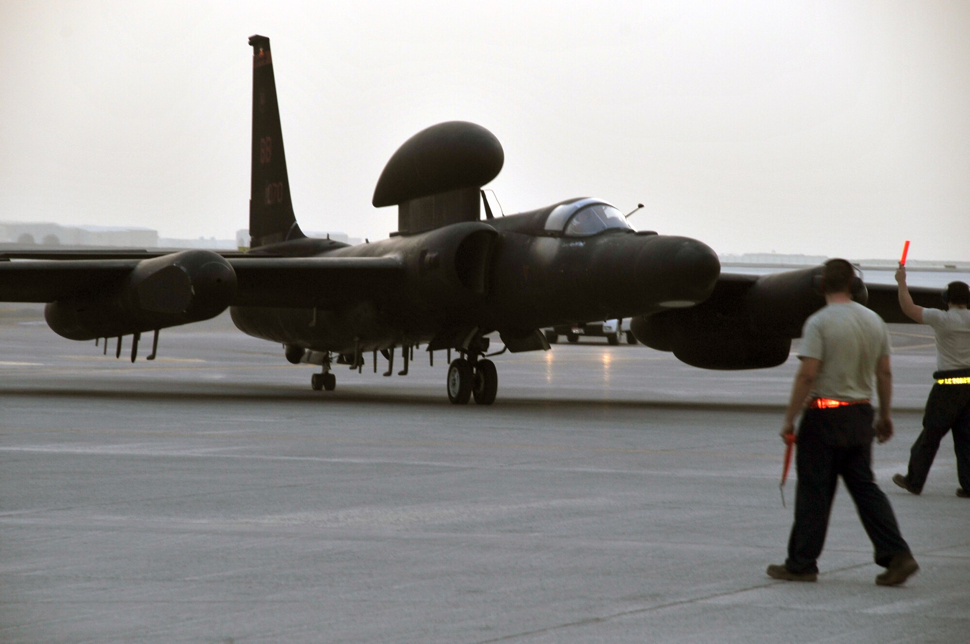 A pilot guides a U-2 Dragon Lady assigned to the 99th Expeditionary Reconnaissance Squadron of the 380th Air Expeditionary Wing to a parking spot on the airfield while being guided by a maintenance Airman from the 380th Expeditionary Aircraft Maintenance Squadron Dragon aircraft maintenance unit at a non-disclosed base in Southwest Asia on April 9, 2010. In the first three months of 2010, U-2s assigned to the 380th AEW and the 99th ERS flew nearly 200 combat sorties in support of operations in the U.S. Central Command area of responsibility. The U-2s, and the Airmen who fly and maintain them, are deployed from Beale Air Force Base, Calif. (U.S. Air Force Photo/Master Sgt. Scott T. Sturkol/Released)