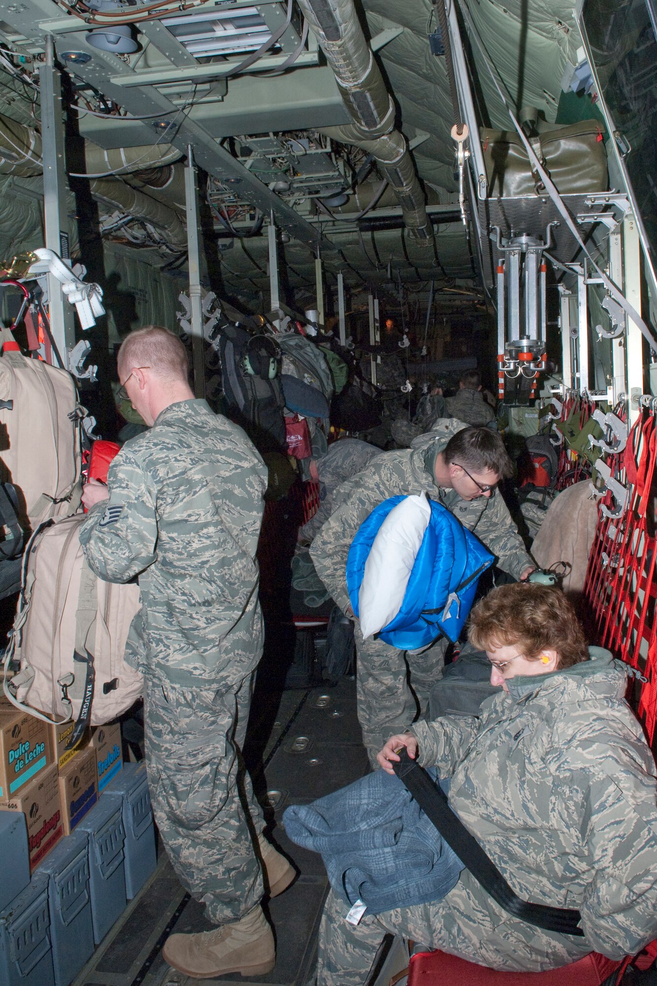Airmen form the 133rd Airlift Wing get settled into a C-130 "Hercules" cargo aircraft on May 1, 2010 as they prepare to launch on a deployment to Southwest Asia.  Minnesotans from the St. Paul Air National Guard base will be transporting troops and supplies supporting Operation Enduring Freedom. USAF photo by Senior Master Sgt. Mark Moss (Released)