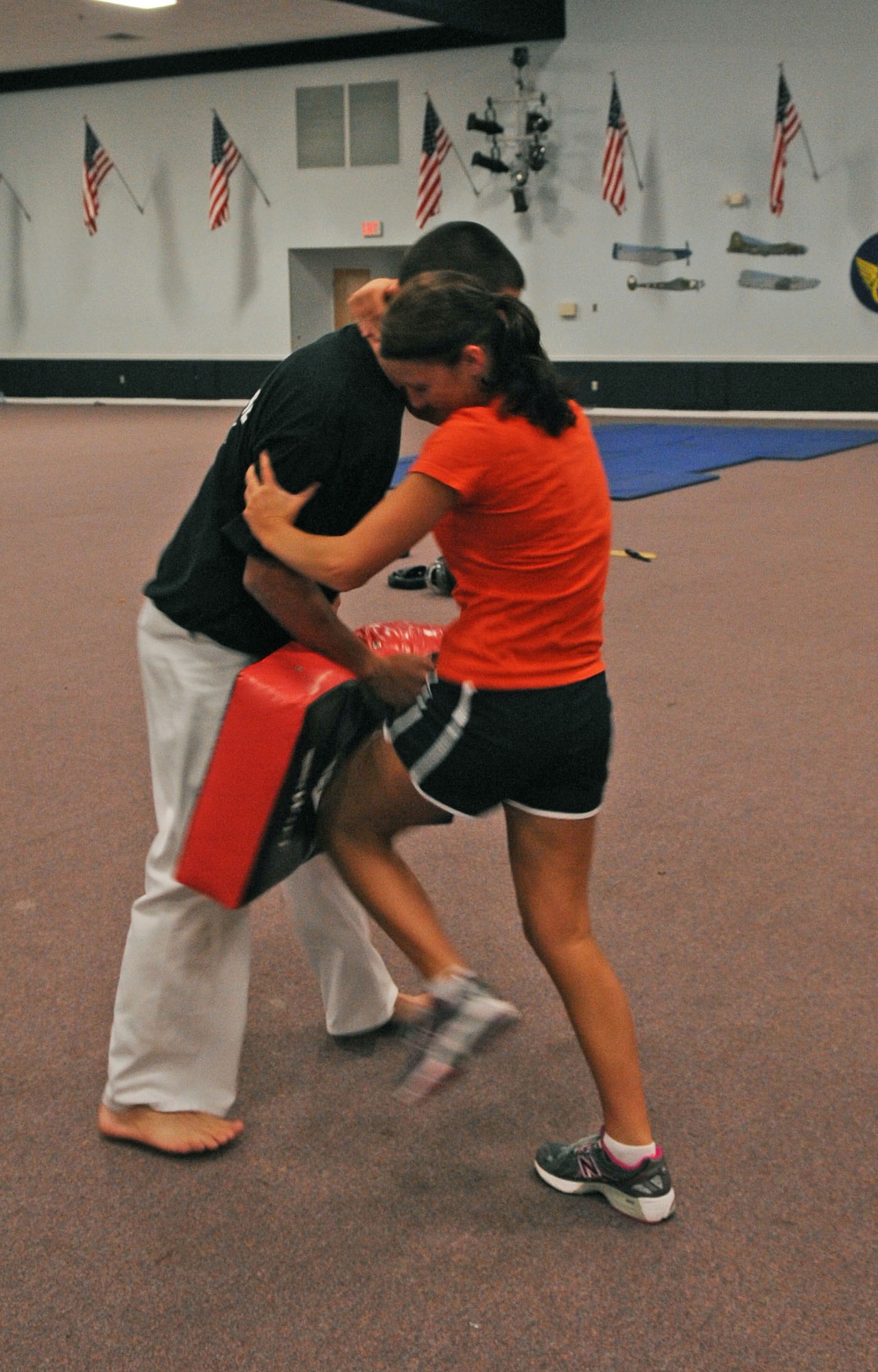 BARKSDALE AIR FORCE BASE, La. -- Staff Sergeant Kari Payne, 2d Force Support Squadron’s assistant base personnel reliability program manager, practices the knee-to-groin attack on Johnathan Hasty, self-defense instructor, at Hoban Hall here April 29. More than 20 participants attended the women’s self-defense class, where they were taught many different self-defense techniques. (U.S. Air Force photo by Senior Airman La’Shanette V. Garrett) (RELEASED)