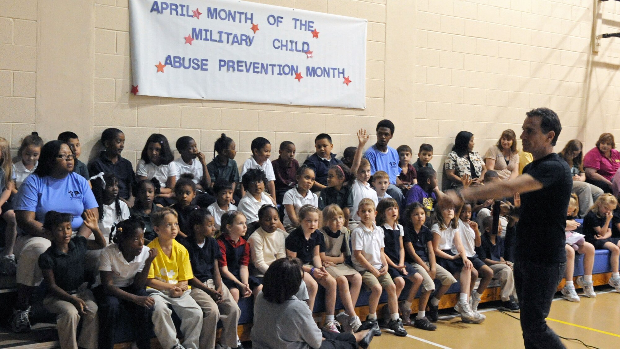 BARKSDALE AIR FORCE BASE, La. -- Children at the Barksdale Youth Center chime in as Year of the Air Force Family guest speaker, Trevor Romain, asks questions April 29. Mr. Romain is an award-winning author and illustrator of a series of self-help books for children. The youth got a sneak peek at Mr. Romains latest video "With you all the way, dealing with deployment."  (U.S. Air Force photo by Senior Airman La’Shanette V. Garrett) (RELEASED)