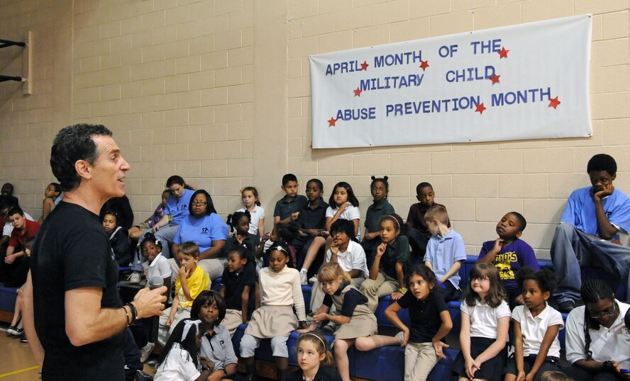 BARKSDALE AIR FORCE BASE, La. -- Award-winning author and illustrator of a series of self-help books for children, Trevor Romain, speaks to children at the Barksdale Youth Center April 29. Mr. Romain was a guest speaker for the Year of the Air Force Family’s Month of the Military Child. The youth got a sneak peek at Mr. Romain’s latest video "With You All the Way, Dealing With Deployment." (U.S. Air Force photo by Senior Airman La’Shanette V. Garrett) (RELEASED)
