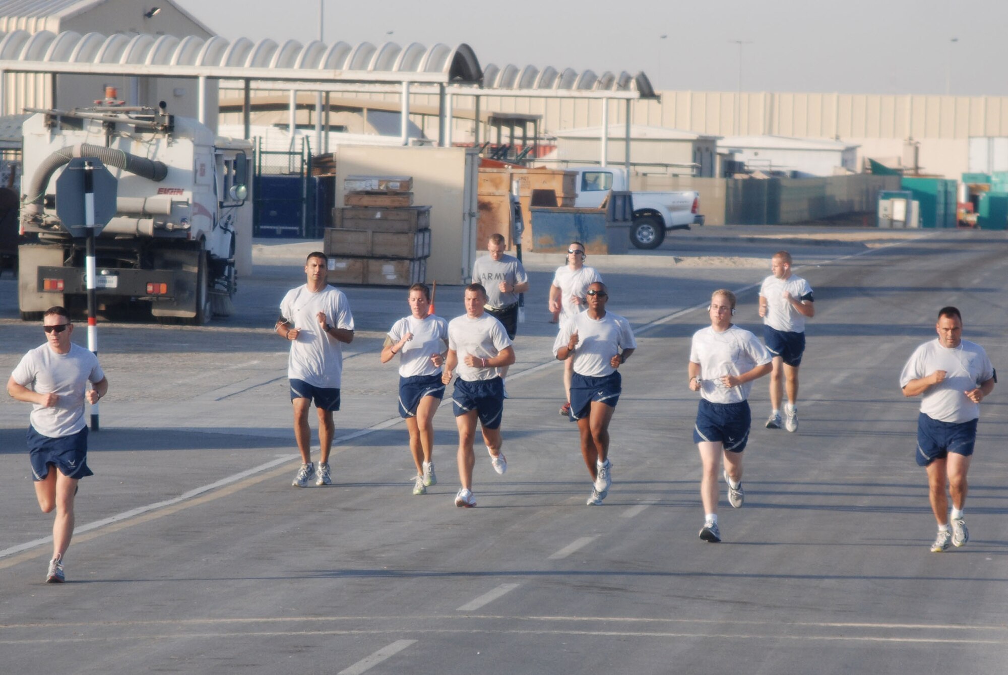 A group of about 20 Airmen deployed to Al Dhafra Air Base in Southwest Asia race to raise money for the Susan G. Komen charity orgazination. The group of about 20 runners was organized by Staff Sgt. Matthew McCarthy, 11th Civil Engineer Squadron. Sergeant McCarthy was able to successfully raise more than $1,000 for donation. (courtesy photo)
