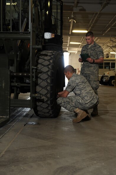 MINOT AIR FORCE BASE, N.D. – Airman 1st Class Peter Rivera and Airman 1st Class Aaron Seymour, both 5th Logistics Readiness Squadron vehicle operators, perform a vehicle inspection on a 10K forklift here April 22. Vehicle operations provides a number of services including base taxi, flight line operations, DV support and government driver’s license issue among others. (U.S. Air Force photo by Tech. Sgt. Lee A. Osberry Jr.)