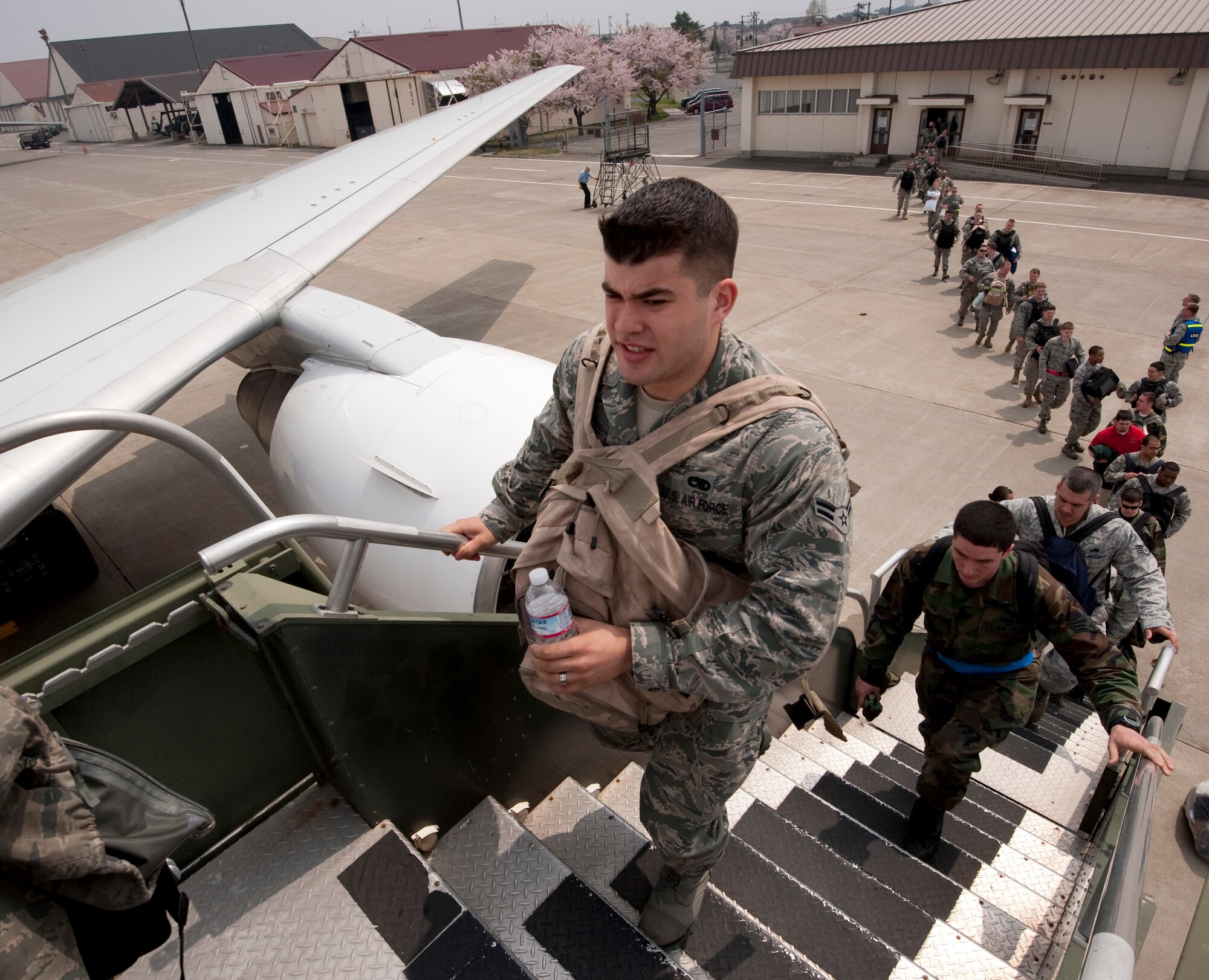 MISAWA AIR BASE, Japan -- Airmen from the 14th Fighter Squadron and Maintenance Unit board an aircraft bound for Republic of Korea May 5. These Airmen deployed to the Republic of Korea in an effort to maintain regional stability in the Asia-Pacific theater and promote stronger relations with U.S. allies. (U.S. Air Force photo/Staff Sgt. Samuel Morse)