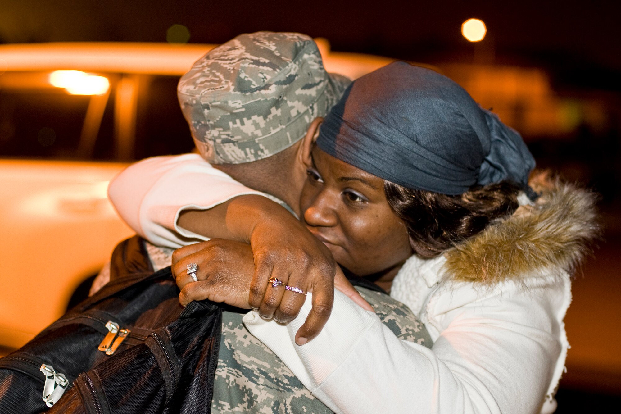 MISAWA AIR BASE, Japan -- Catina Germany hugs her husband, Staff Sgt. Anthony Germany, 35th Maintenance Squadron avionics craftsman, May 5 outside of Hangar 949. Sergeant Germany, along with the main body of the 14th Fighter Squadron and 14th Aircraft Maintenance Unit, deployed to the Republic of Korea in an effort to maintain stability in the Asian-Pacific region. (U.S. Air Force photo/Senior Airman Jamal D. Sutter)